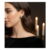 ⁦حلق رقيق مطلي باللون الذهبي ، بتصميم قلب ملتف مرصع بفصوص زركون بيضاء براقة. يتوسطه شكل دائري لامع يضيف لمسة أنيقة.⁩ - الصورة ⁦7⁩